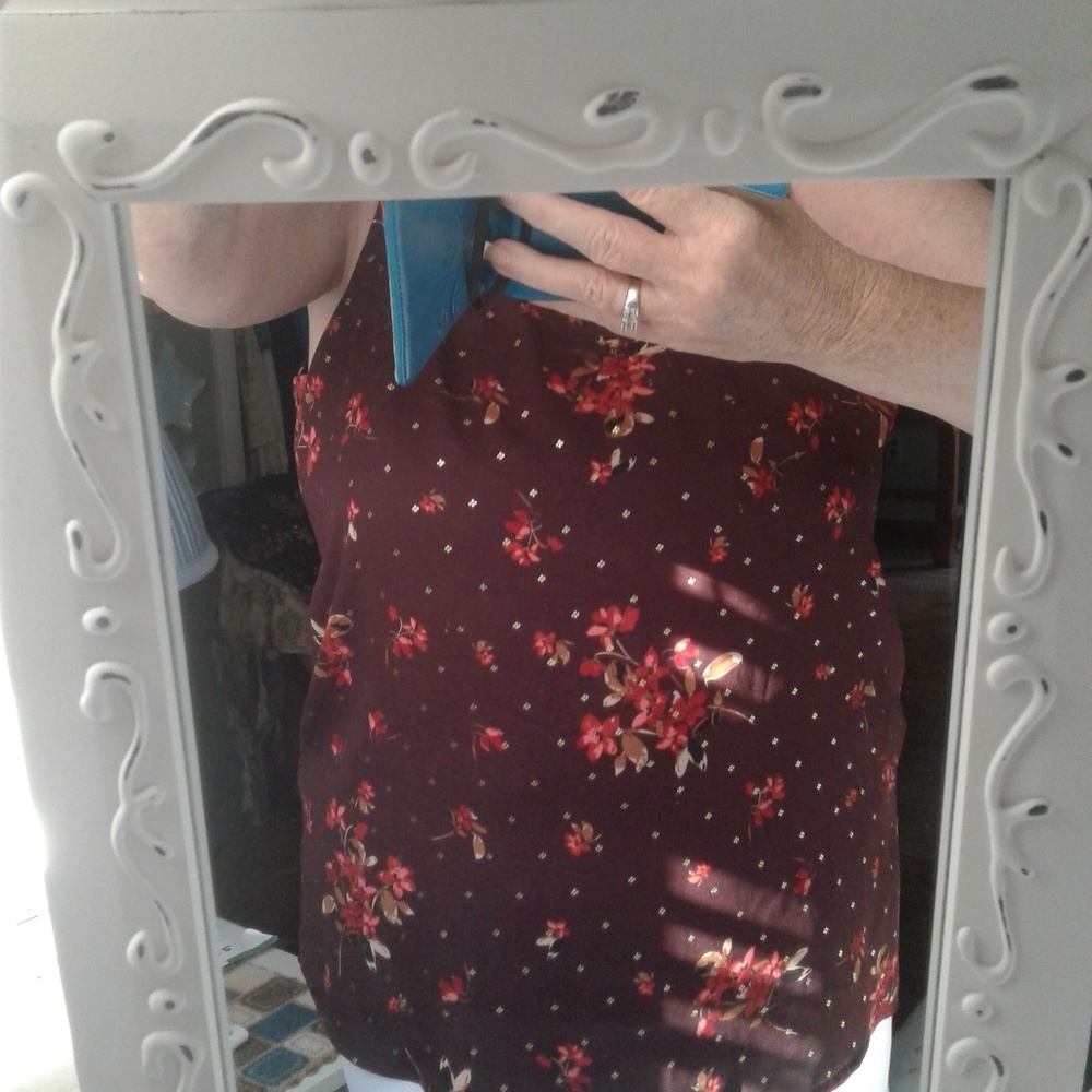 burgundy blouse with floral print/gold accents.